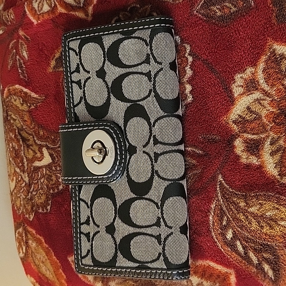 Authentic Coach Signature Black Turn lock checkbook wallet. Lavender leather.